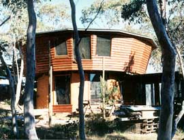 Builder and Co-op resident, Godfrey Davies, built himself a comfortable yurt. The yupper yurt structure rests on a mudbrick lower level.