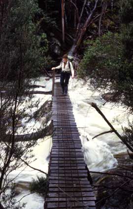 Some time after the journey described in this story, a proper suspension bridge, complet with hand rails, was built across the Fish River. Here, a hiker crosses the Fish in its summer flow.