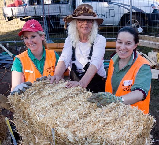The first bale is placed at Carrs Park Community Garden's outdoor classroom.  (From left): Jenny Howie (Kogarah Council), Susan (Huff'N'Puff). Fiona stock (Kogarah council).
