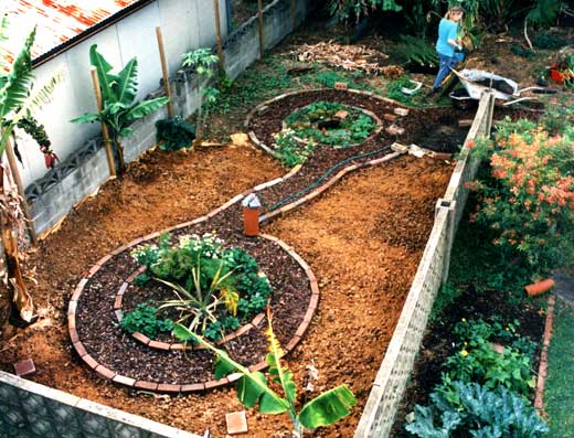 mont-garden2 Garden paths made, the soil mulched and perennials planted, the garden is almost ready for planting out.