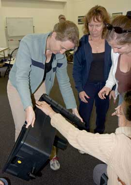 Sustainable Gardening course participants learn how to assemble a wormery.